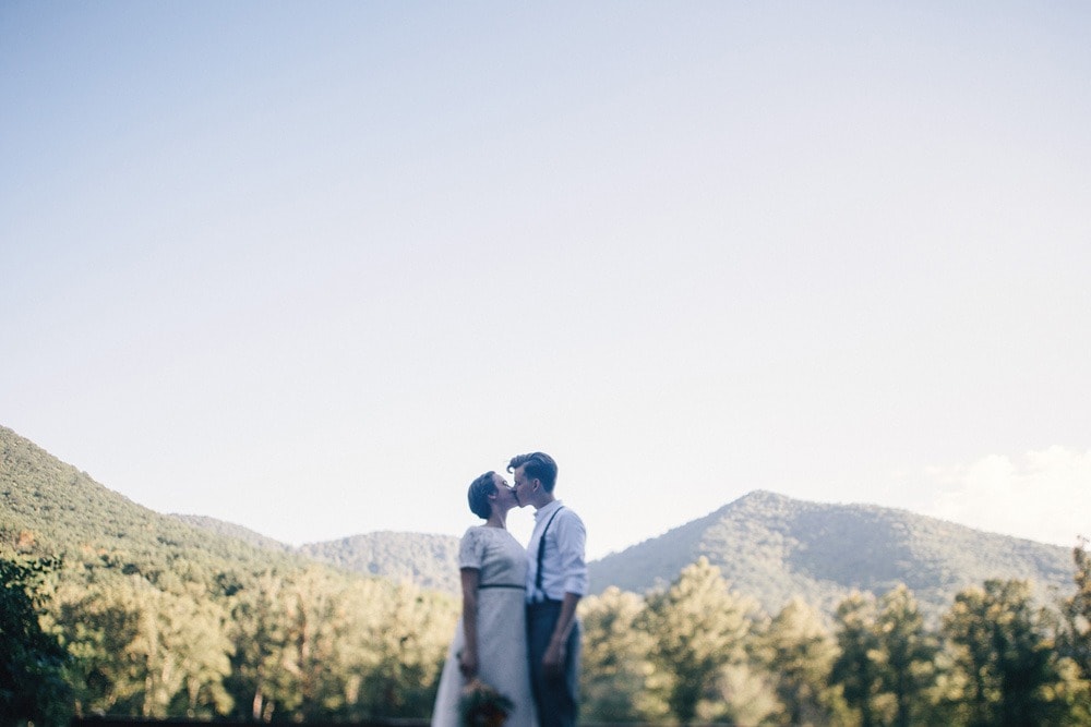 married couple in front of mountain backdrop at brahma ridge