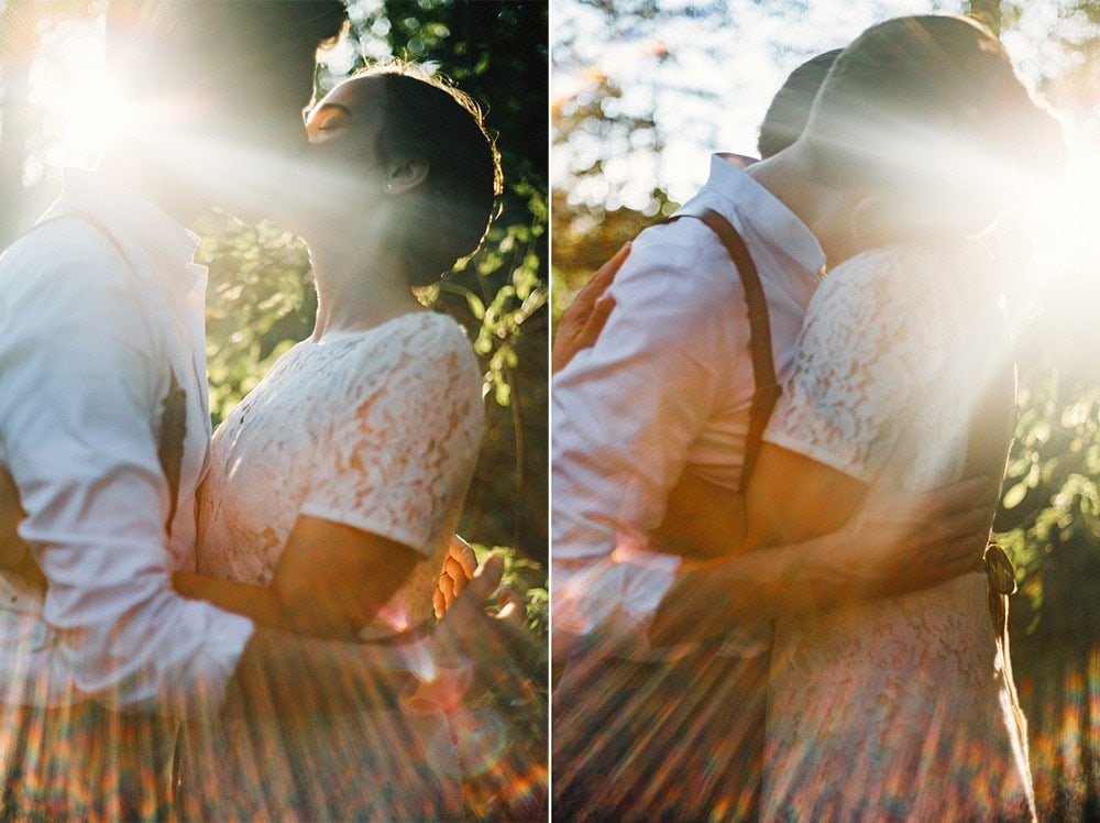 married and kissing at sunset