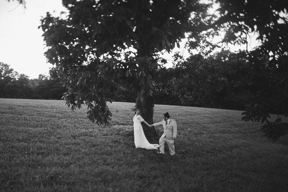 bride and groom under big tree at terrapin hill