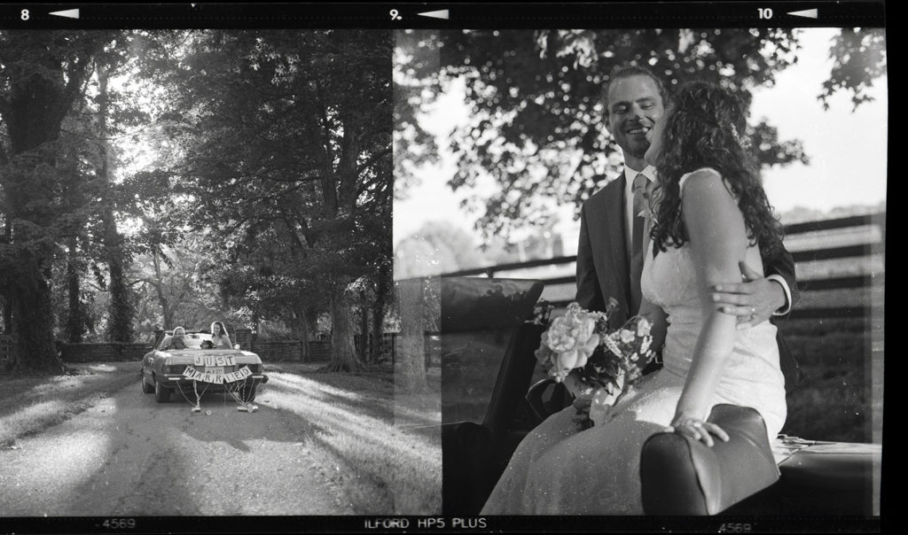 wedding portrait with classic car on black and white film